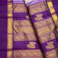 Royal purple Rettapet border with gold zari Yaanai motifs in floral framing on a Kanchipuram silk saree