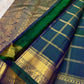 Royal teal blue pure silk Zari Kattam Kanjeevaram saree, draped front view