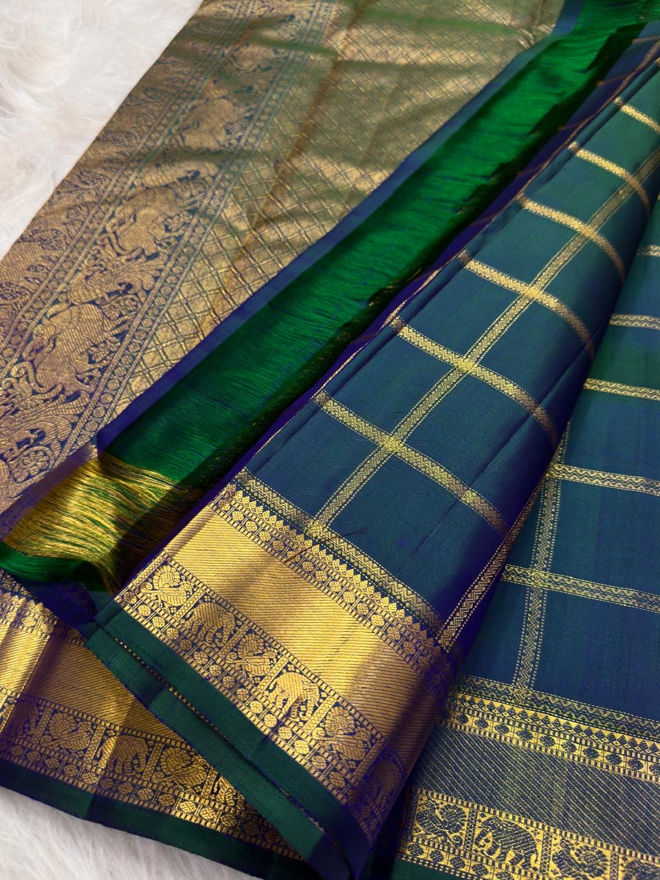 Royal teal blue pure silk Zari Kattam Kanjeevaram saree, draped front view