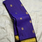 Close view of antique-gold zari buttas woven on Royal Violet Kanjivaram silk.