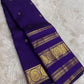 Royal violet handwoven Kanchipuram silk saree with Rettapet border, full drape view.