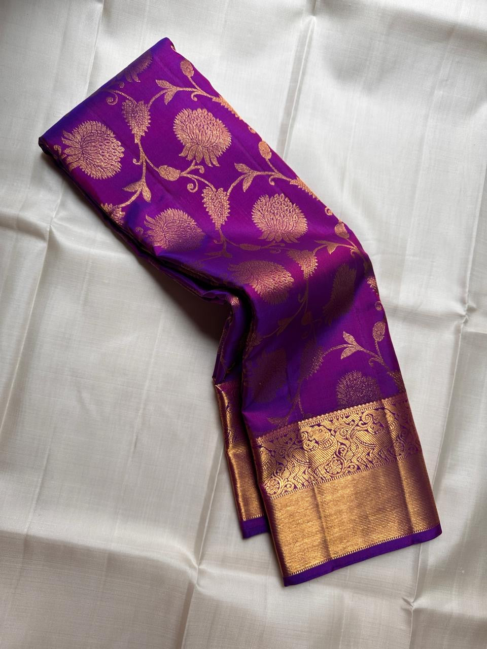Royal violet handwoven Pure Silk Kanjivaram Zari Kattam saree with floral jaal, full drape view.