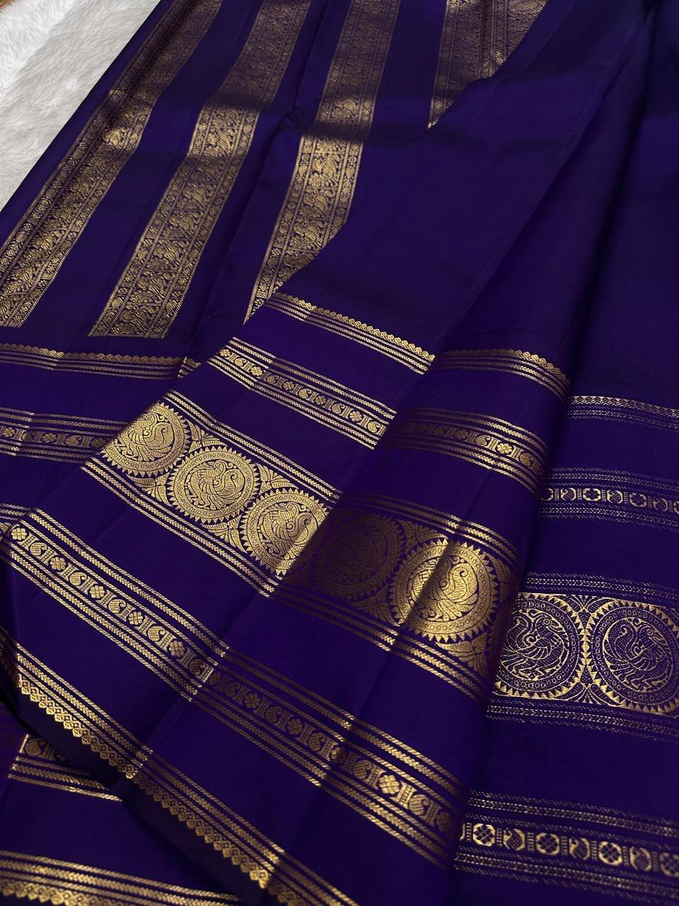 Royal violet handwoven Kanjivaram silk saree, additional drape view.