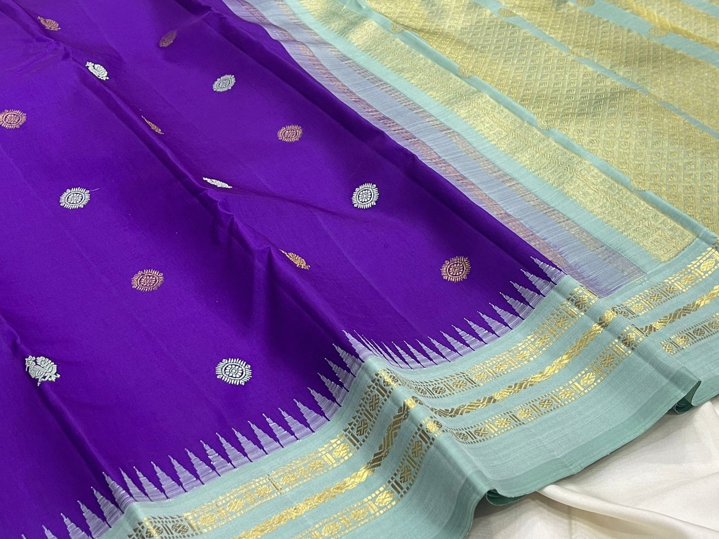 Handwoven pure silk Kanjeevaram saree in royal violet blue with Mayil Chakram buttas and ice blue Korvai border Silk Mark certified