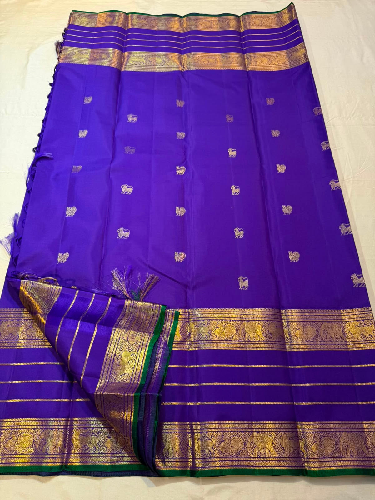 Full view of royal violet Kanchipuram silk saree with yazhi butta and plum varisaipet border — Idam Living