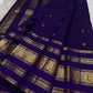 Royal violet Kanjivaram pure silk saree, close view of the zari medallion border.