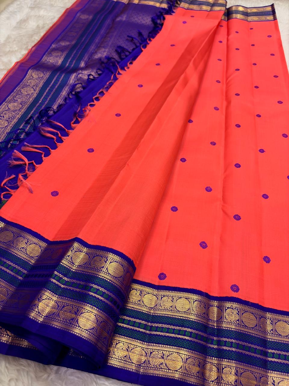 Royal violet korvai border detail on coral sunset orange pure Kanchipuram silk saree