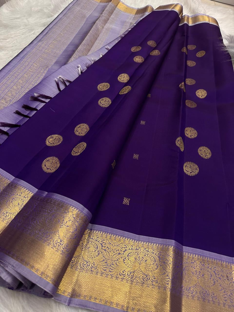 Royal Violet Kancheepuram Saree. Body close up showing gold zari medallions