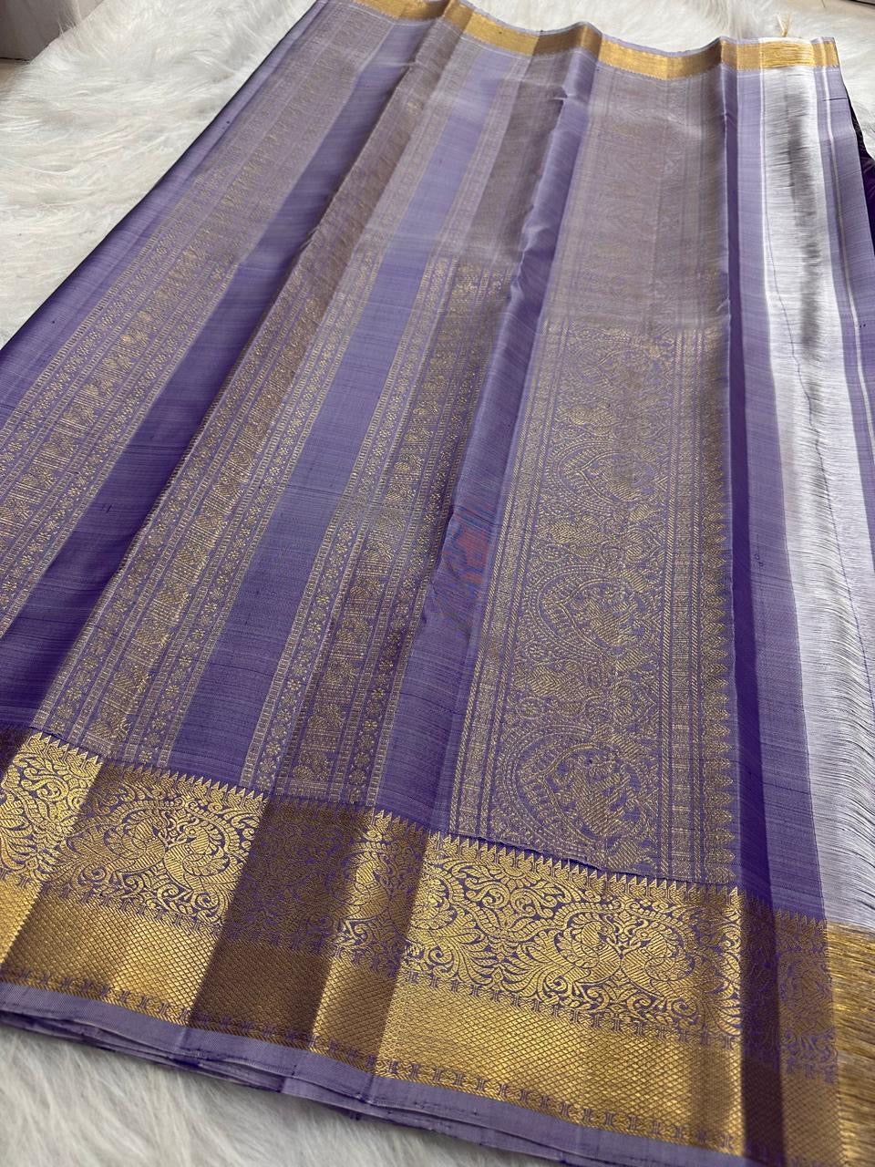 Royal Violet Kancheepuram Saree. Lavender grey Korvai border with gold zari detail