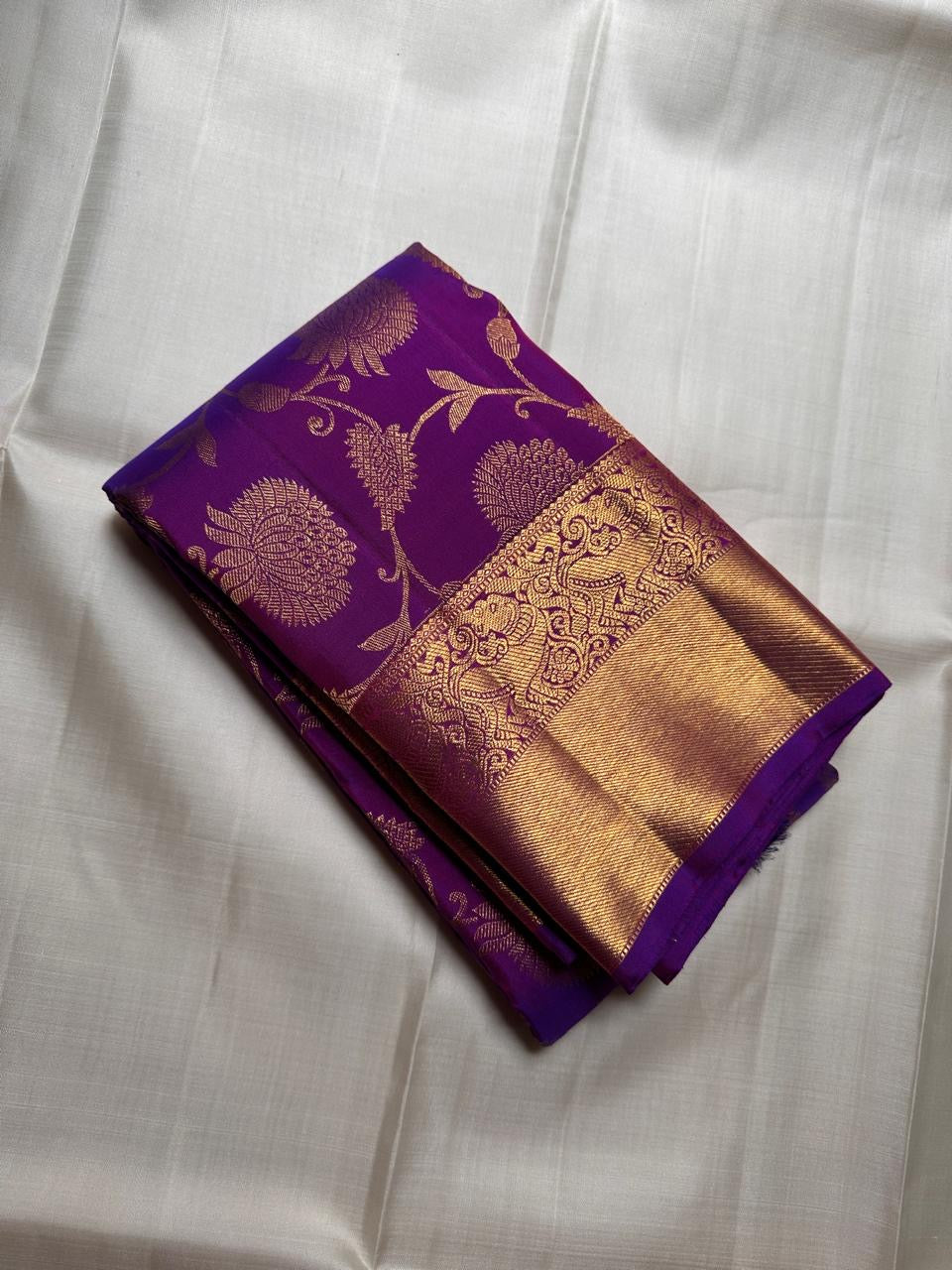 Royal violet pure silk Kanjivaram Zari Kattam saree showing floral jaal detail.
