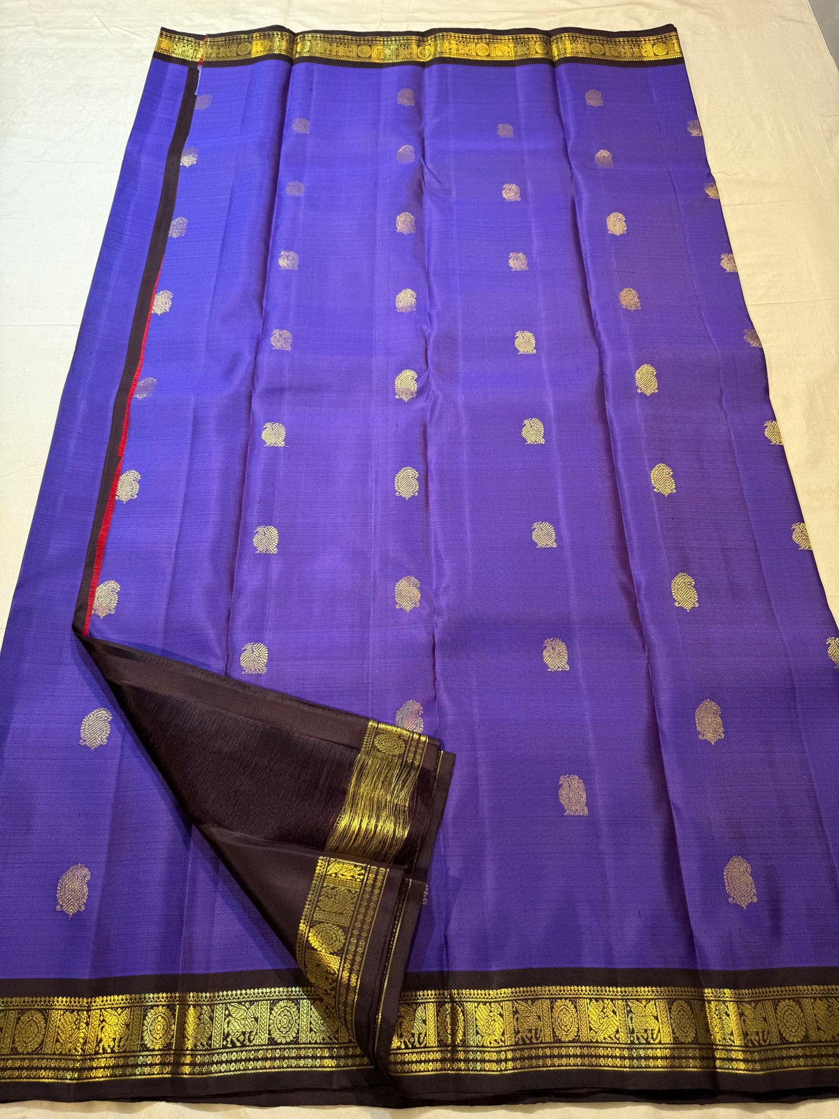 Royal Violet Kanchipuram silk saree with individually spaced antique-gold zari buttas.