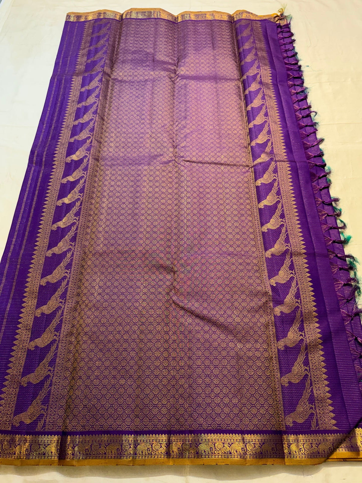 Violet Kanchipuram Vairaoosi saree with large handwoven traditional bird zari motifs.