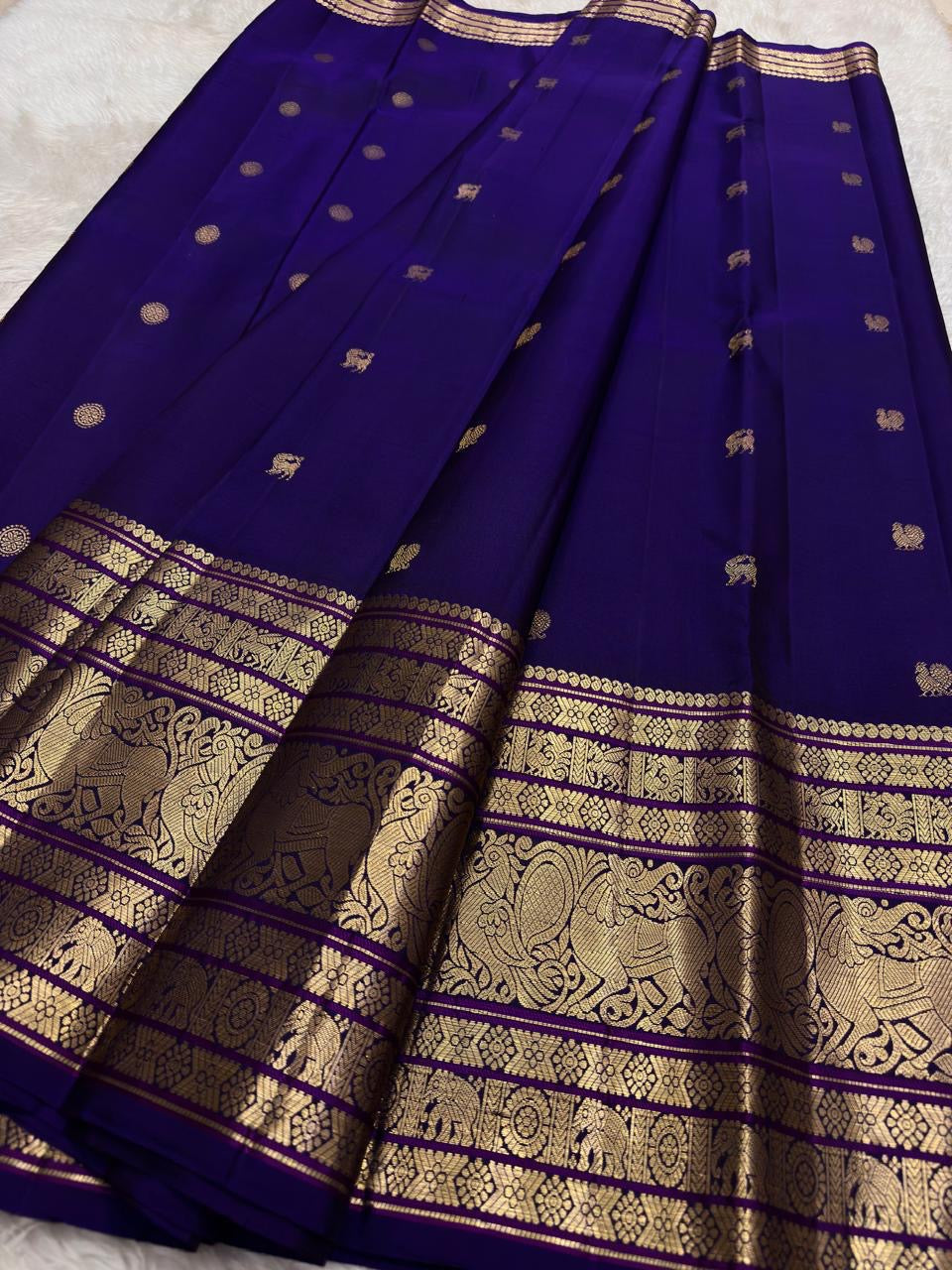Handwoven Kanjeevaram Korvai saree featuring amethyst violet body and majestic Gandaberunda border
