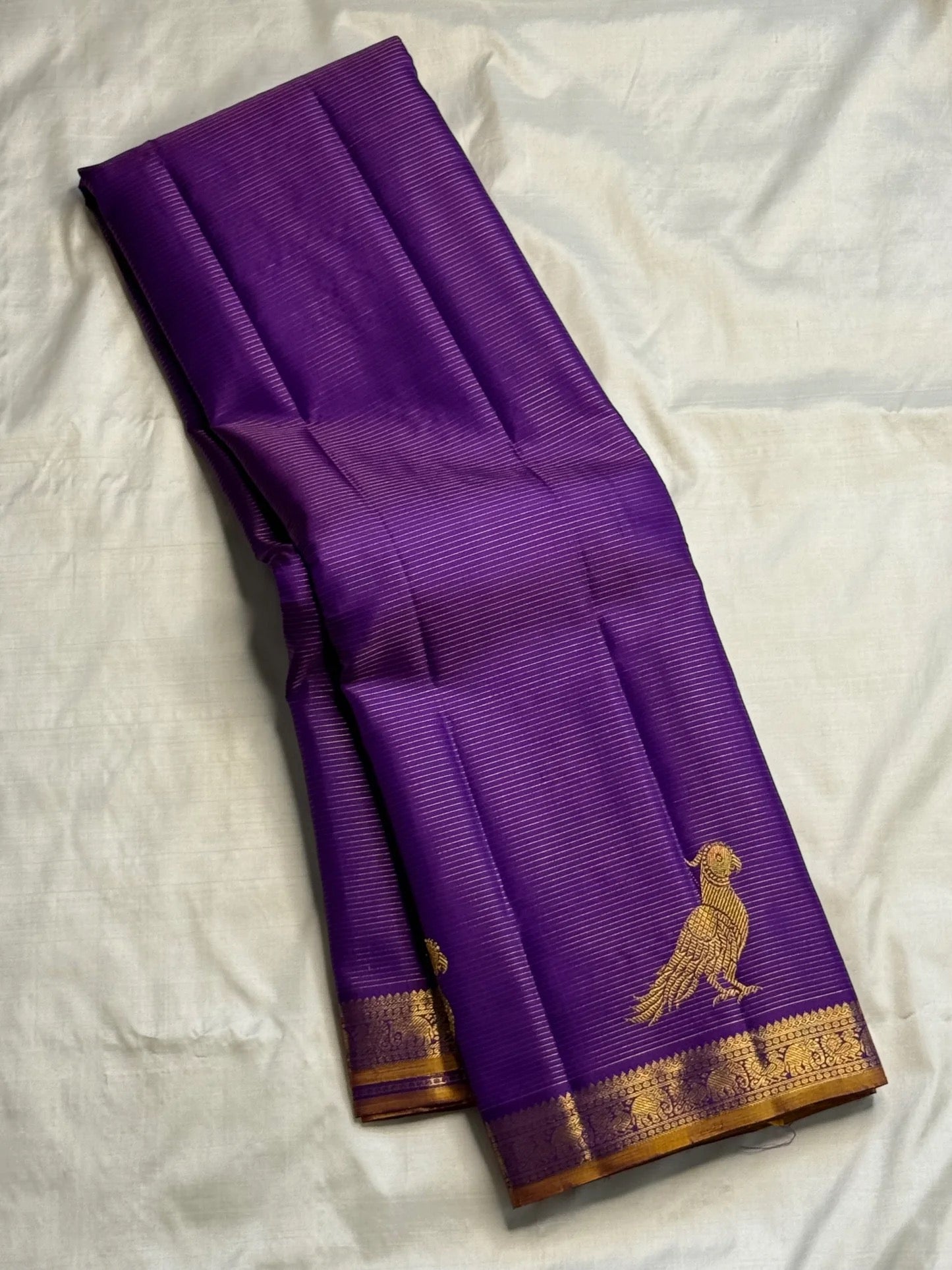 Royal Violet Purple pure silk Kanjivaram Vairaoosi saree with fine antique-gold parallel zari lines.