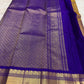 Royal violet zari border on a Kanchipuram Korvai saree in burnished mustard gold