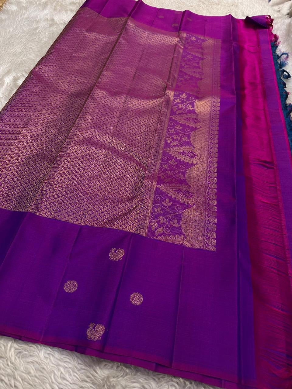 Vivid magenta gold zari pallu detail on royal blue saree