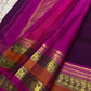 Royal aubergine Kanjipuram pure silk saree draped, showing Rettapet twin border
