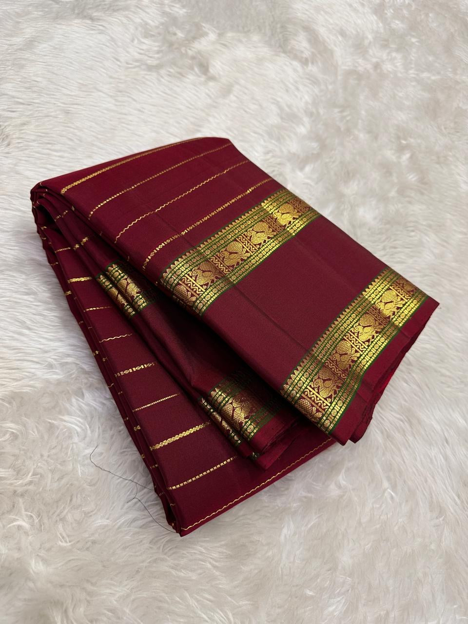 deep red Kanchipuram silk saree with rt-vh weave folded view