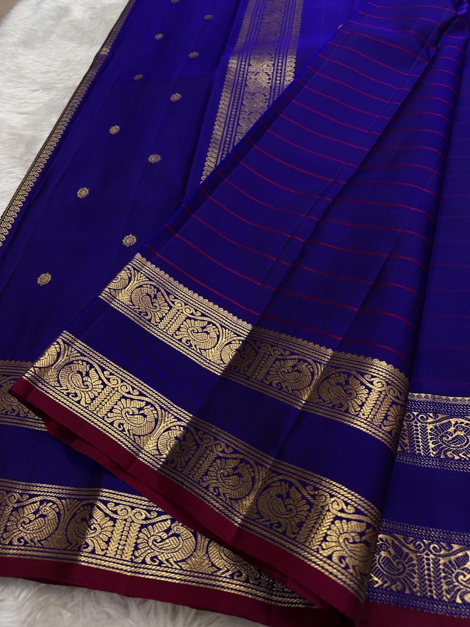 traditional tested zari detail on ink blue Kanchipuram silk saree