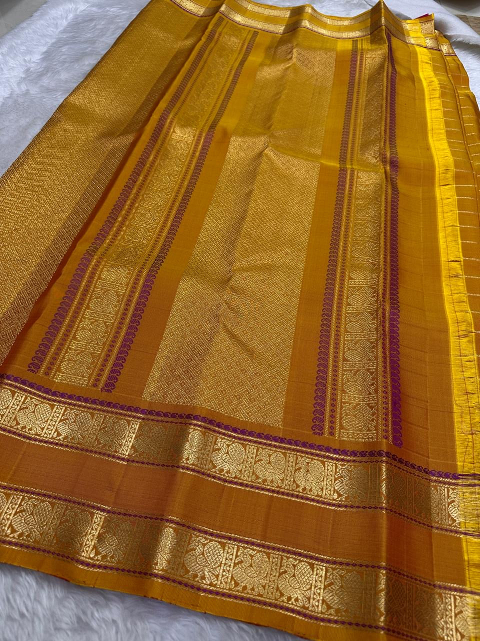 traditional tested zari detail on mustard gold Kanchipuram silk saree
