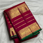 Luxury ruby berry silk saree with richly woven traditional zari border.