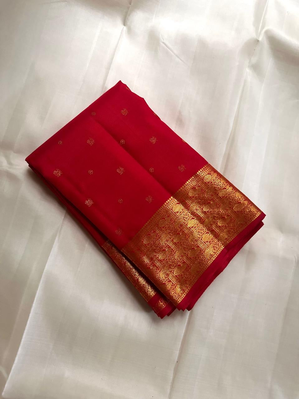 Kanchipattu silk saree in ruby red with antique gold border Varisaipet weave traditional zari detail