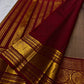 Broad traditional red border framing a chandanam (sandalwood) silk saree