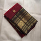 Ruby red pure silk Kanjeevaram saree with deep brown border and teal zari accents