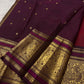 Ruby red Kanchipuram silk saree with sorgavaasal mayil border detail
