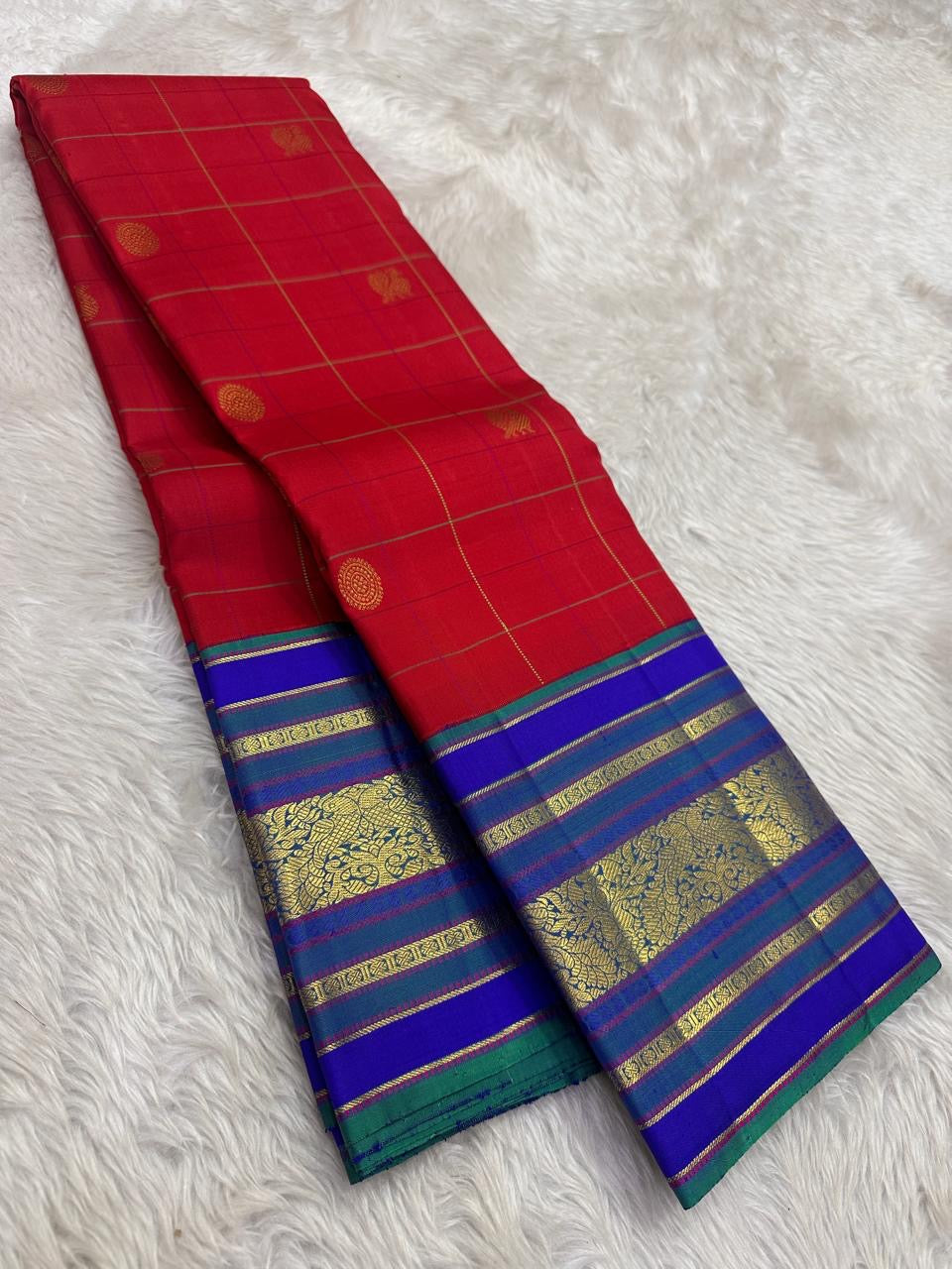 Ruby red Kanjeevaram silk saree violet korvai border mayil chakram zari butta