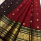 Ruby red Korvai Kanjeevaram silk saree body close-up with deep brown border detail