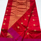 Broad copper-gold-toned woven pallu on a red and pink Chanderi handloom saree.