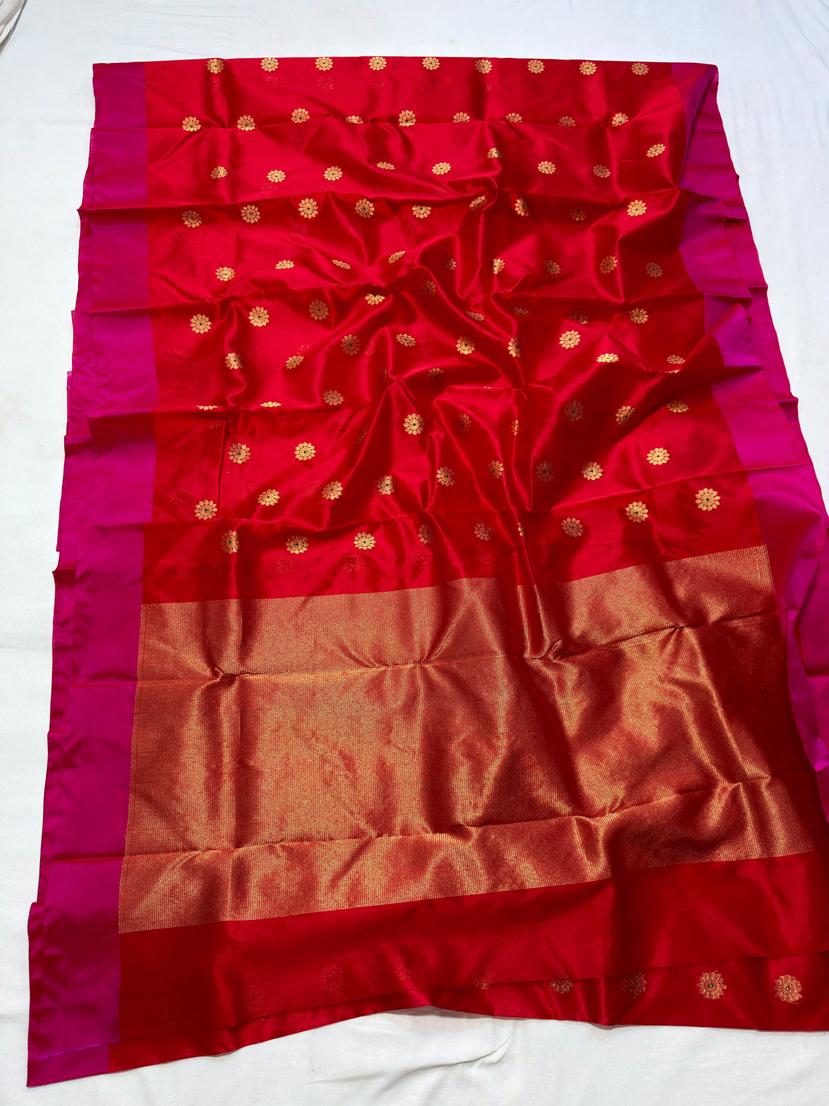 Ruby red floral Pattu Silk Chanderi saree with broad rani pink borders.