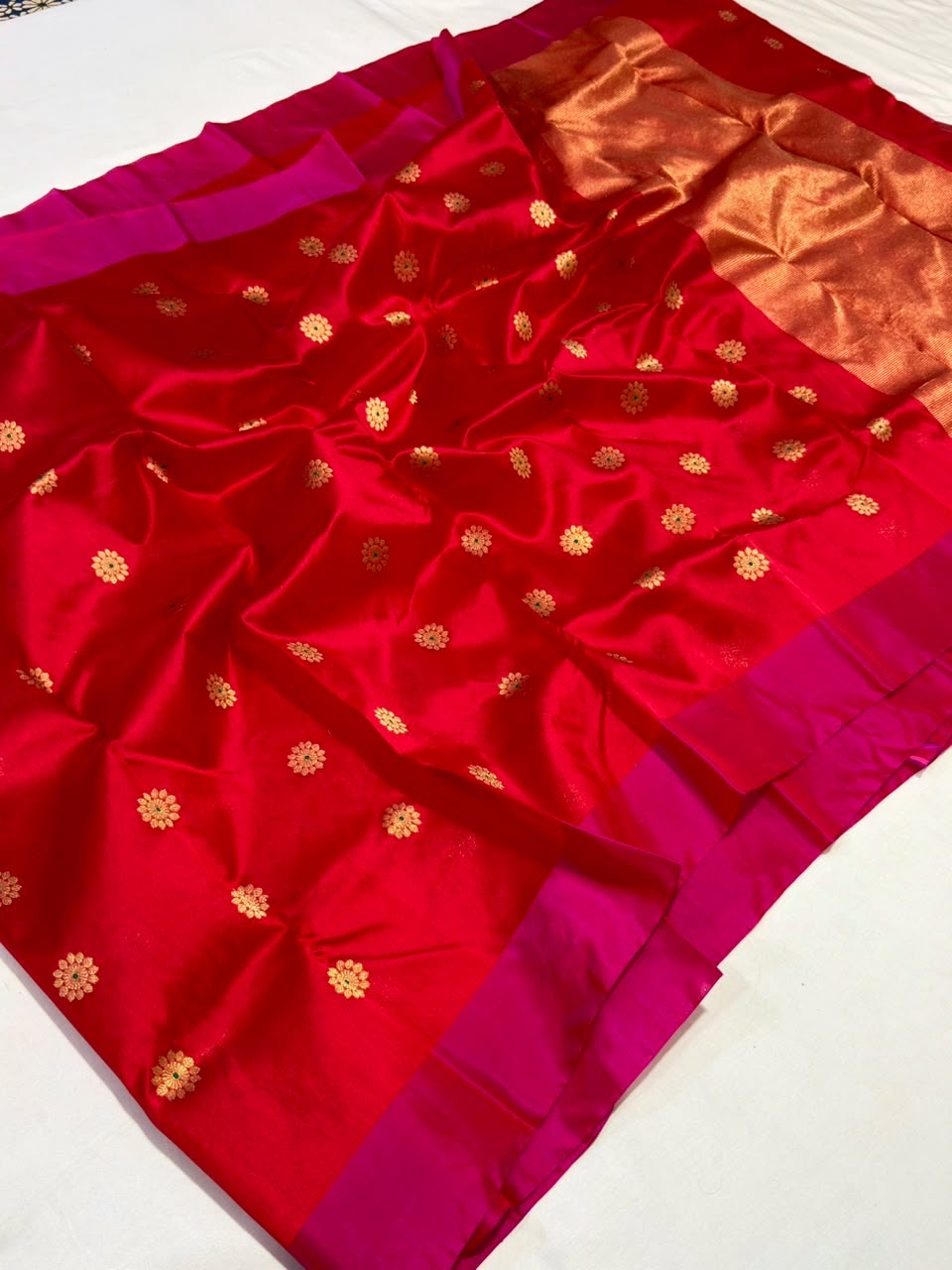 Ruby red Pattu Silk Chanderi handloom saree with rani pink borders and a copper-gold pallu.