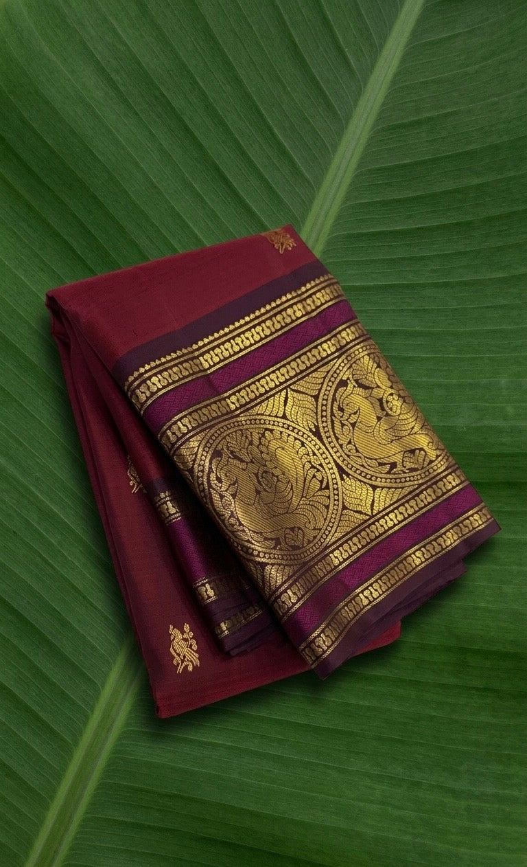Ruby wine red Kanjivaram silk saree with plum violet border – front view