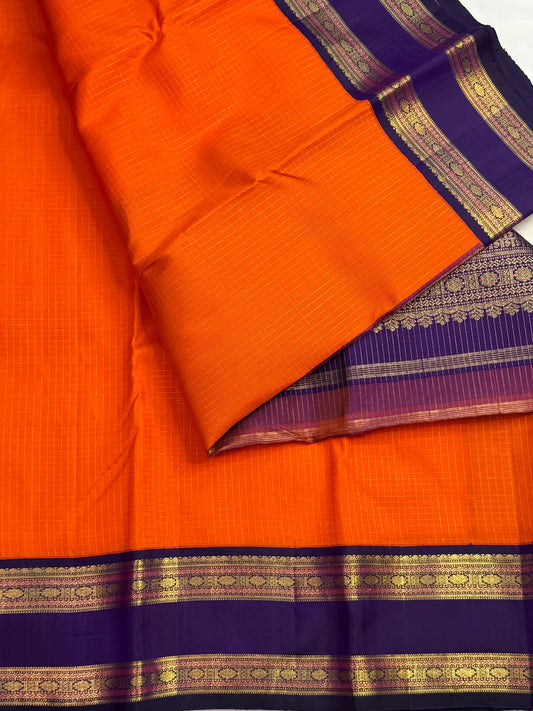 Royal purple Rettapet border with gold zari Rudraksham and Diamond Petti on orange Kanjeevaram silk