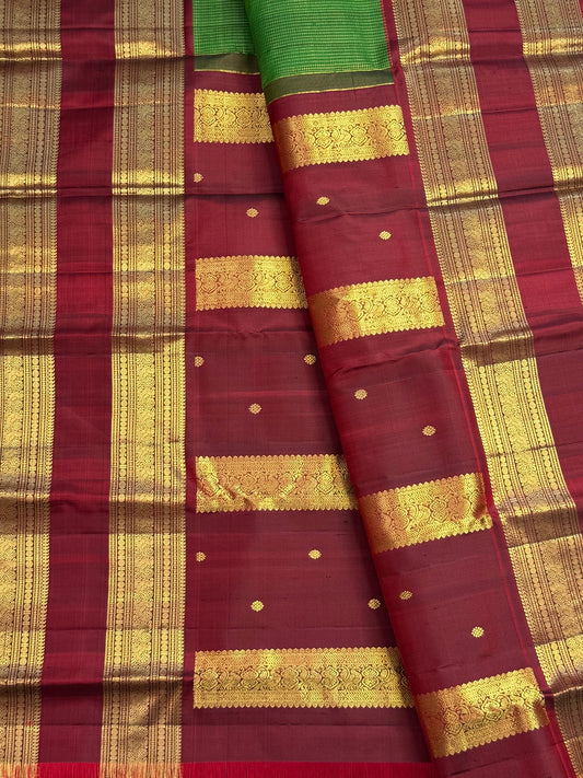 Rudraksham Pet gold zari border detail on leaf green Kanchipuram silk saree