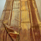 Close view of fine diagonal antique-gold zari ribbing on Rust Gold Kanjivaram silk.
