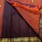 Handwoven Korvai saree with Deep Brown contrast border and antique-gold motif registers.