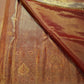 Banarasi-style antique-gold pallu with paisley and floral zari registers.