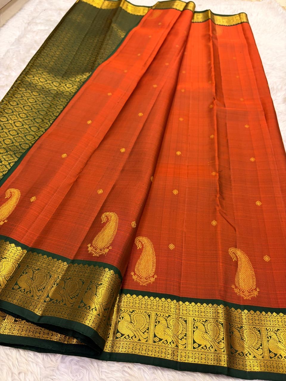 Forest green border with gold zari mayil peacock panels on rust orange Kancheepuram silk saree — Idam Living
