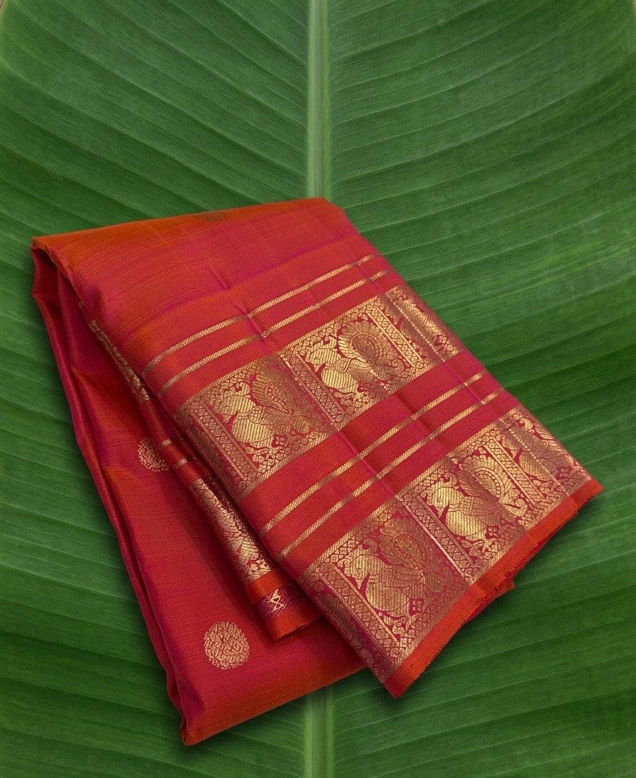 Kanchipuram silk saree in vermilion red with gold border Mayil Butta weave folded view
