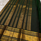 Sorgavasal peacock medallion close-up on rust orange Kanchipuram pure silk saree — Idam Living