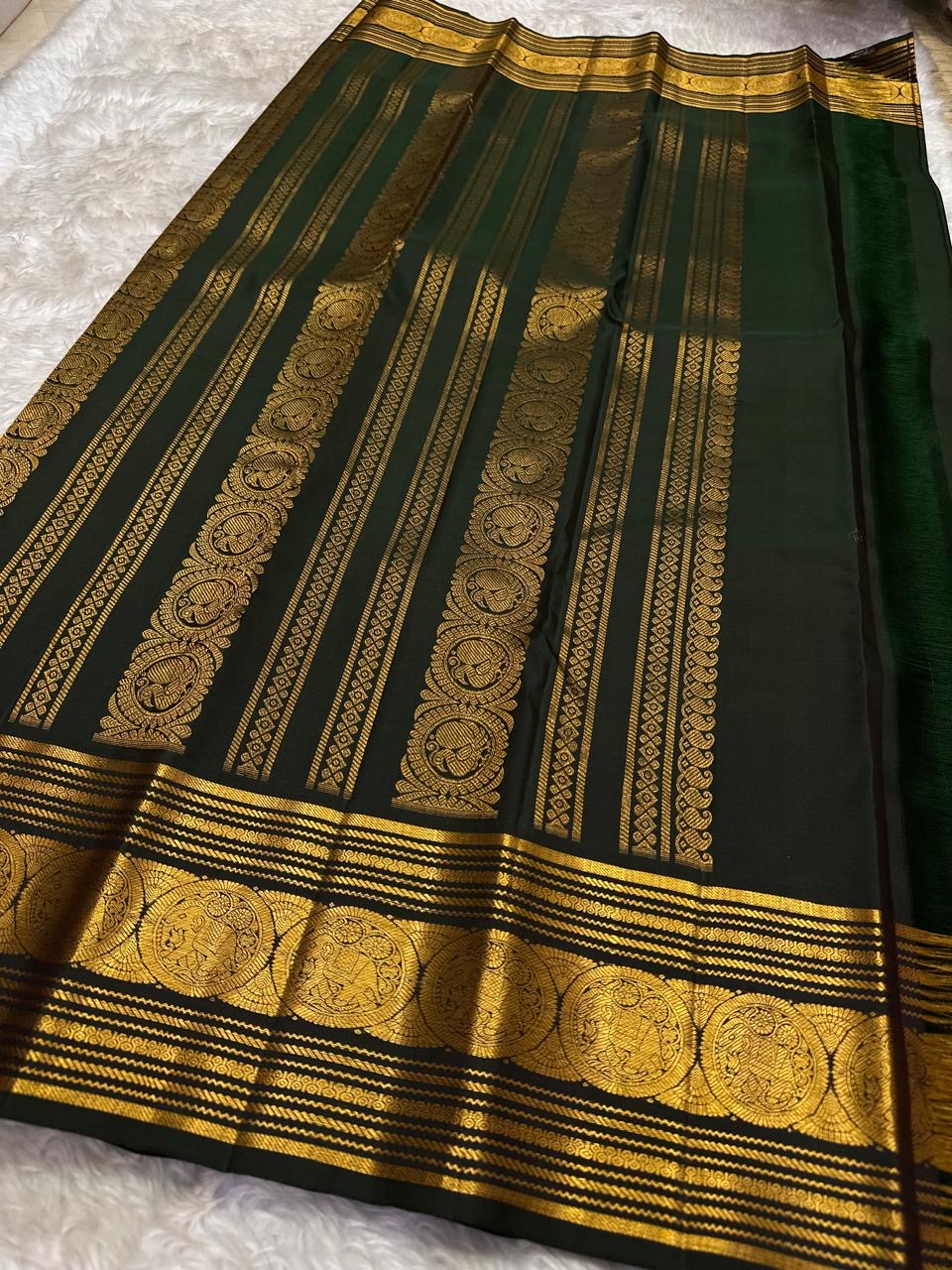 Sorgavasal peacock medallion close-up on rust orange Kanchipuram pure silk saree — Idam Living