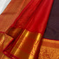 Orange Kanjivaram saree with deep navy contrast border