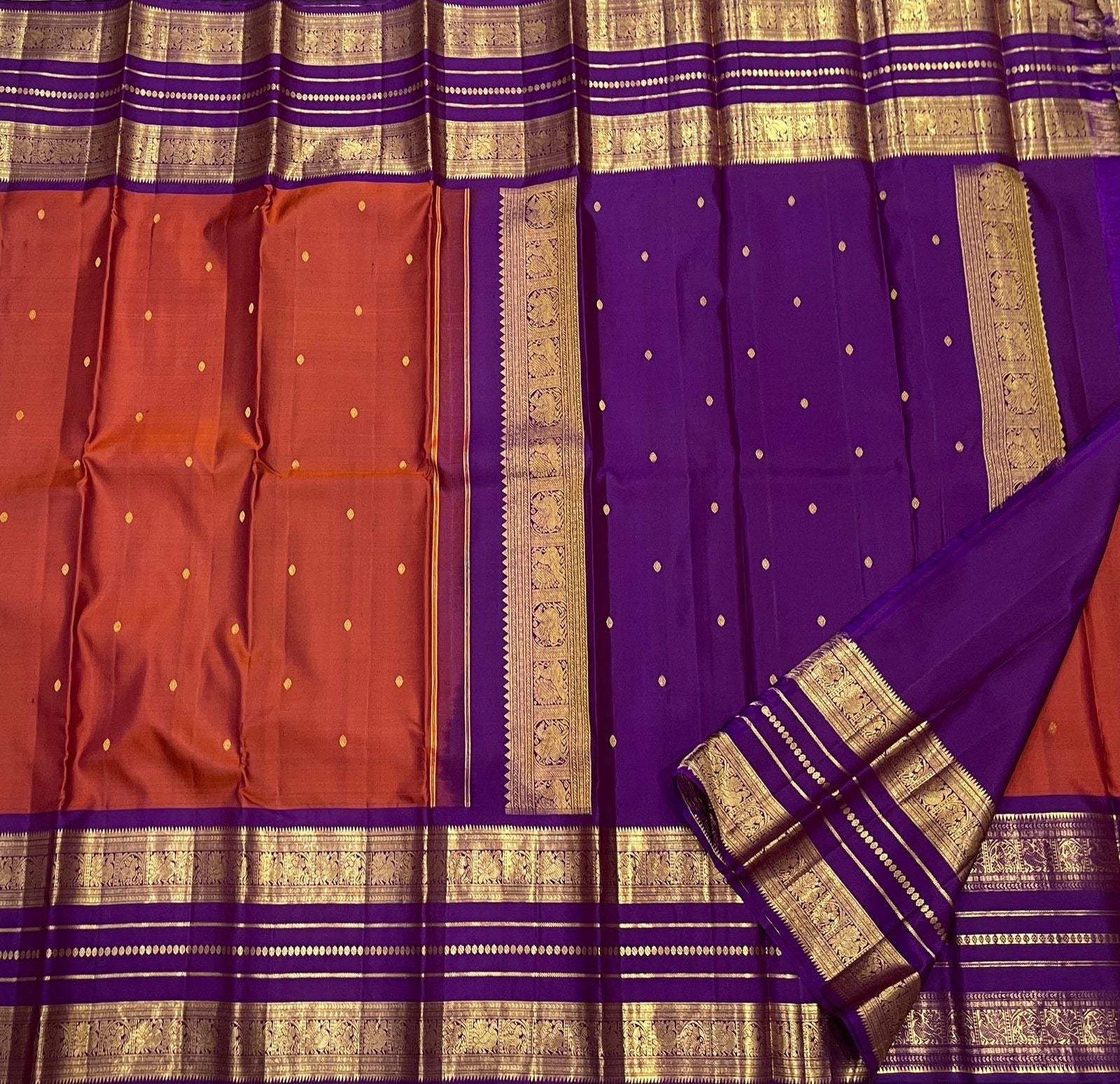 Kathiripoo Purple Kanchipuram silk body with small individual gold zari buttas.