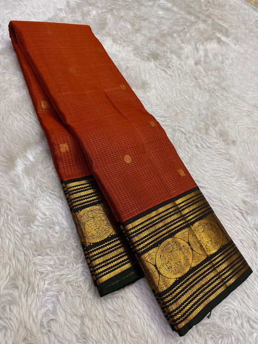 Rust orange handwoven Kanjeevaram pure silk saree with zari kattam body and sorgavasal peacock black korvai border — Idam Living