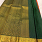 Deep forest green pallu with large gold zari peacock motifs on rust orange Kanchipuram silk saree — Idam Living