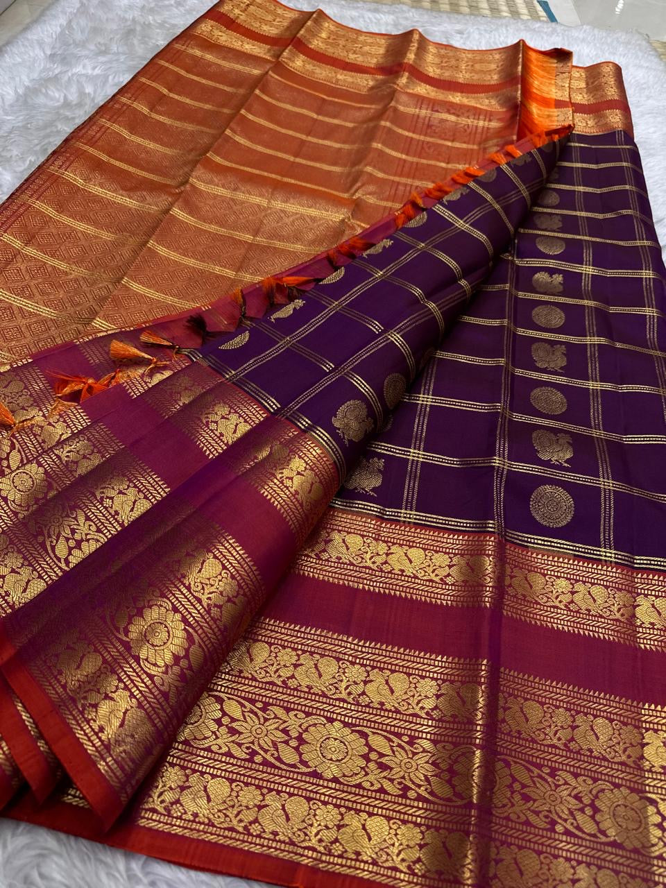 Dense vanasringaram gold zari border on rust orange korvai of chocolate brown Kanchipuram saree — Idam Living
