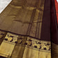 Rust red Kanchi Pattu saree — deep aubergine border and pallu detail